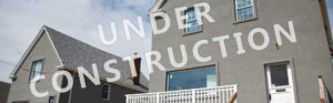 Picture of a house that reads "under construction"