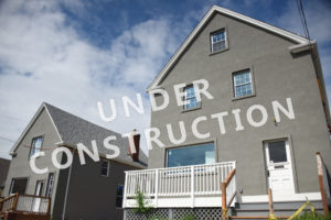 Image of a house that reads "under construction"